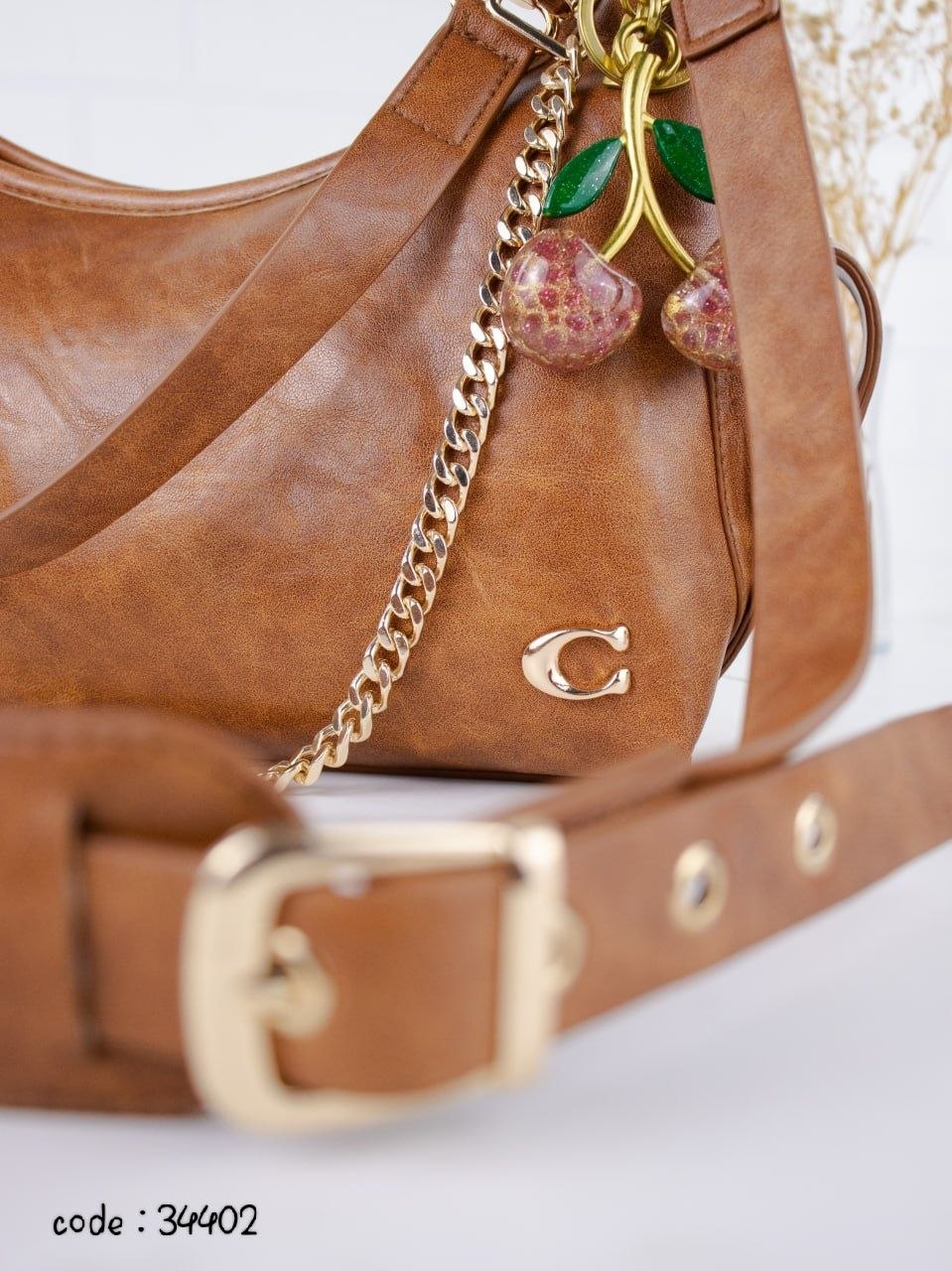COACH Chic Slouchy Hobo Bag with Cherry Charm
