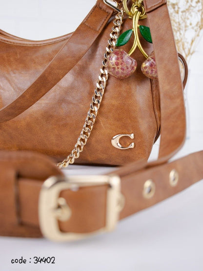 COACH Chic Slouchy Hobo Bag with Cherry Charm